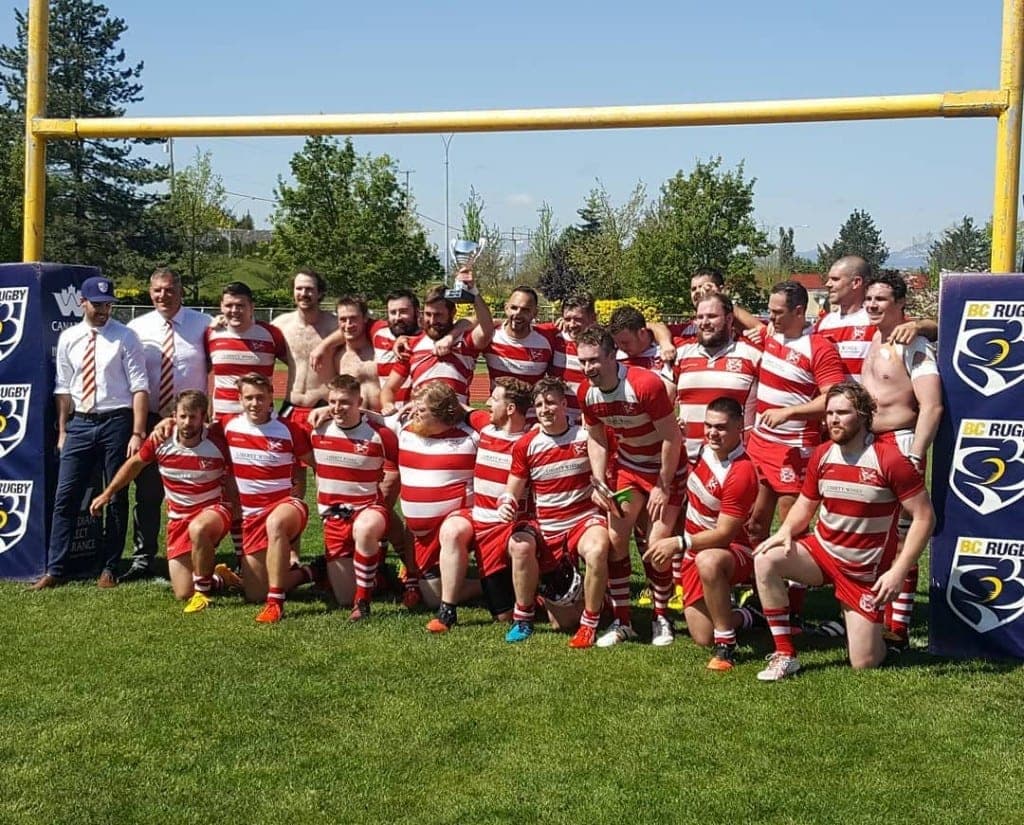 VRC Rugby celebrating a BC Rugby championship win under the posts at Brockton Oval in Stanley Park, Vancouver