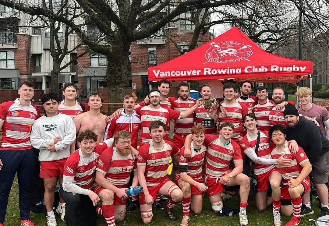 VRC Rugby men's senior side celebrating a BC Rugby trophy at Brockton Oval in Stanley Park, Vancouver